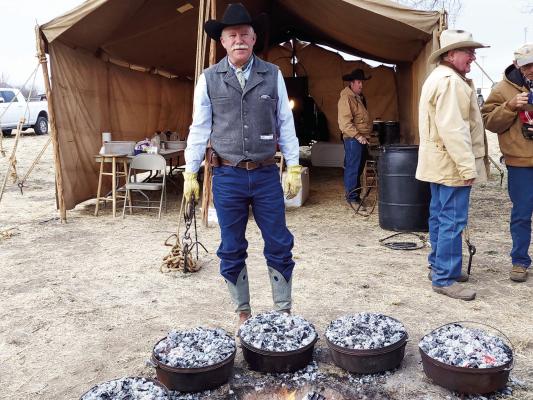Robert Leese watches over several Dutch ovens full of biscuits at this past weekend’s Chuck Wagon breakfast held at Poet’s Grove. The Chuck Wagon breakfast is an annual event held during the Lone Star Cowboy Poetry Gathering. Avalanche photo by Kara Gerbert
