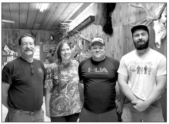 Lead taxidermist Sam Cook, owners April and Howard Parsons, and taxidermist Caleb Hughes. Avalanche photo by Roxanne Hill