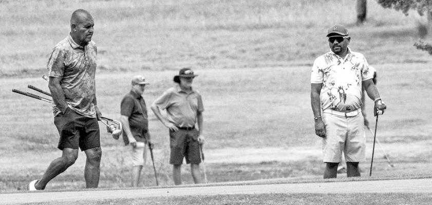 Adam Gonzales looks intensely at the green as he prepares to hit his next shot while Vimal Bhakta looks on. Both golfers are from Fort Stockton and competed in this year’s Legends golf tournament held this past Saturday and Sunday here in Alpine. Photo by Kara Gerbert