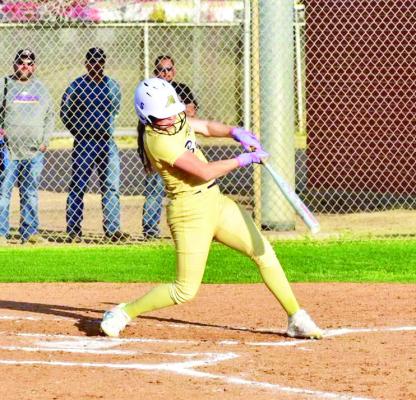 Kacy Hawkins drives a single to bring in a run, giving the Lady Bucks a 3-2 advantage. Photo by Felipe Fierro