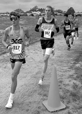 Hatfield Cason, who placed eighth overall in this past Saturday’s cross-country race in Lubbock, keeps the pace among the other competitors. Cason finished the race with a time of 17:03. Courtesy photo