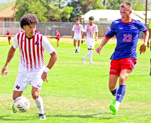 Mario Hurtado attempts to work around a UC Colorado Springs player on Thursday. Photo by Alexandria Nava-Elizando