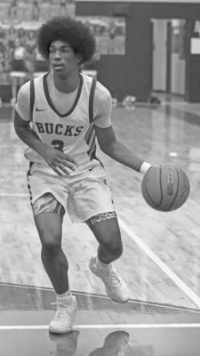 Dae Hardwick effortlessly controls the basketball during a basketball game held on his home court against Fort Stockton. Photo by Felipe Fierro