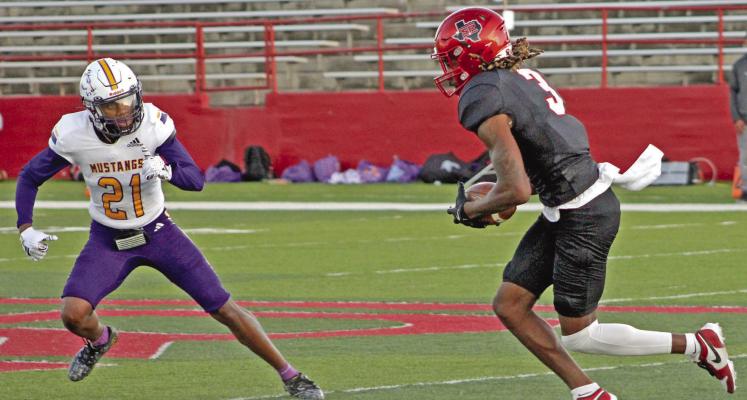 Lobos wide receiver Austin Ogunmakin weaves to get by Western New Mexico’s defensive back David Miller during Sul Ross’ homecoming win over the Mustangs Saturday night, which earned them the Golden Tumbleweed trophy and their first Lonestar Conference win. Sul Ross (1-4) will face the Angelo State Rams (5-0) this coming Saturday in San Angelo Photo courtesy of Sul Ross Sports