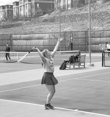 Esther Lotti makes a serve during the Jean Everett Memorial Tennis Invitational at Sul Ross where she placed first in girl’s singles. Courtesy photo