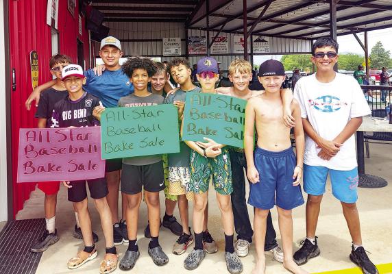 These young men took an opportunity to earn some money for their All-Star baseball team recently, holding a bake sale at Skelton’s Runway. They energetically ran back and forth to the street, encouraging those driving by to stop in and support their cause. Photo by Kara Gerbert