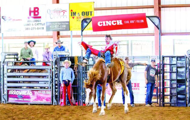Bareback rider Garrett Blackwell sits atop one of Sul Ross’ bucking horses during an afternoon practice at the S.A.L.E. Arena. Photo by Kara Gerbert