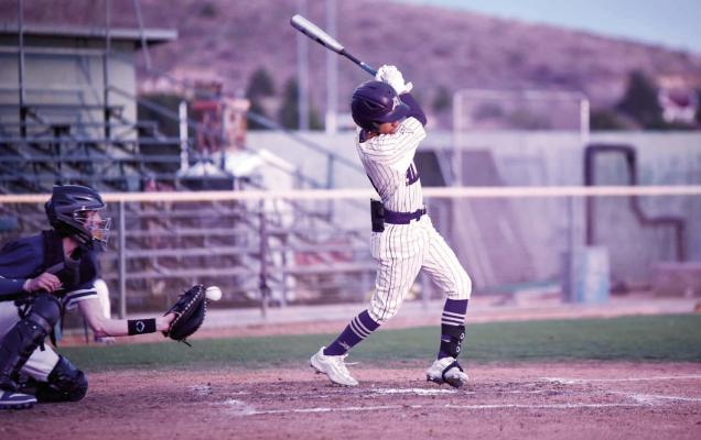 Iden Lujan takes a strike during the Alpine Bucks’ home game last week against Midland. The Bucks came away with a victory over the Eagles with a score of 13-8. Photo courtesy of Noe Lujan