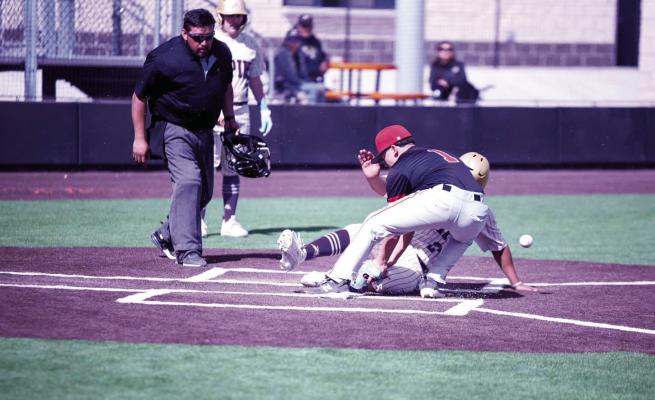 An Alpine Buck slid into Homeplate at Wink last Friday as a Wildcat player attempted to tag him out. Photo by Noe Lujan