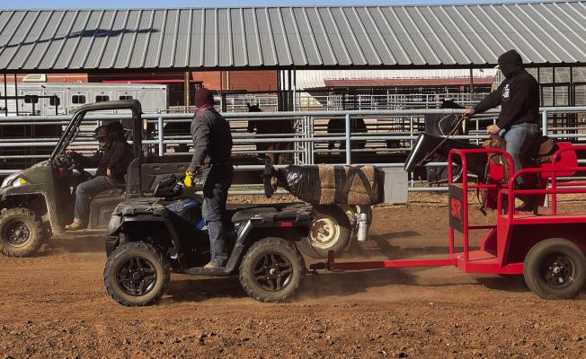 Despite the chilly temperatures, Sul Ross Rodeo Team members utilize the Smarty Rodeo equipment during practice. The men here are practicing their bulldogging techniques using the horse saver and a dummy steer to hone their technique before they take on the live animals. Photo courtesy of Sul Ross Rodeo Team
