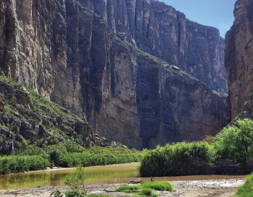 The 1500-foot canyon walls that announce Santa Elena Canyon in Big Bend National Park stand silent on Sunday, August 16, except for the ripple of water across rocks in the riverbed of the Rio Grande. From the path of destruction seen from the parking lot at Santa Elena to the Cottonwood Campground turnoff, silence was not the case earlier in the week. Photo by Kara Gerbert