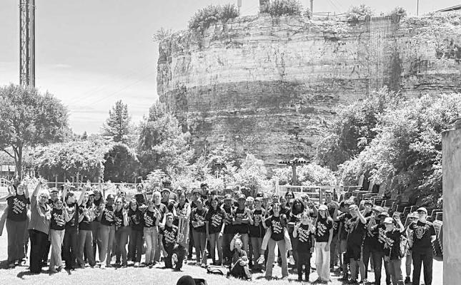 The Alpine Middle School Fightin’ Buck Band recently performed in San Antonio at the Six Flags amusement park. Pictured is the band and their director Ms. Maria Azar at the park. Courtesy photo
