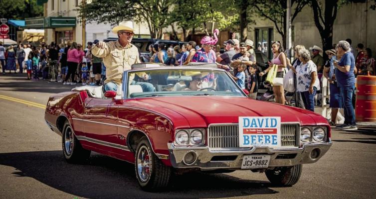 County Commissioner waves to spectators