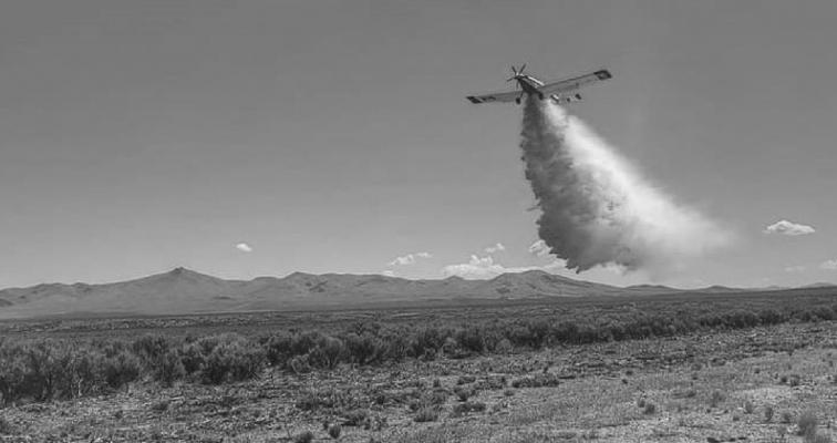 Aerial fire retardant is spread by firefighters. Courtesy photo
