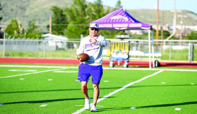 Fightin’Bucks coach Jerry Dominguez signals to players during the Purple and Gold Night practice session Friday at Bucks Stadium. Photo by Felipe Fierro