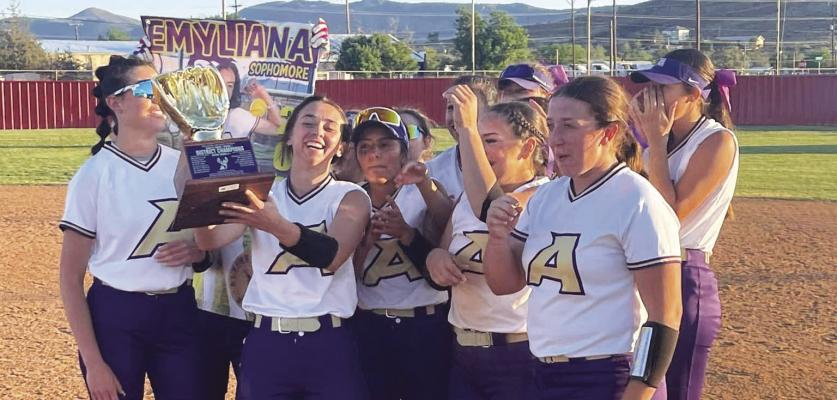 The Alpine Lady Bucks celebrate their district championship win together on Monday. The Lady Bucks won 14-4 against the Kermit Yellow Jackets during their final home district game and Senior Night. Courtesy photo