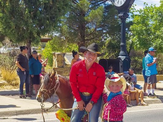 Kristy and Jacob Cross participated in this past Saturday’s Cinco de Mayo parade. Jacob dressed his pony up with paper flowers to help celebrate the event. Photo by Kara Gerbert.