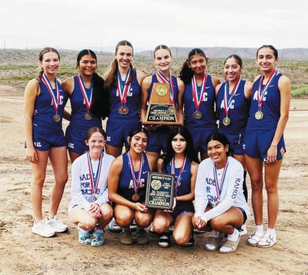 The Runnin’ Lady Bucks varsity cross country team brought home its third consecutive district title in Presidio last week. Courtesy Photo