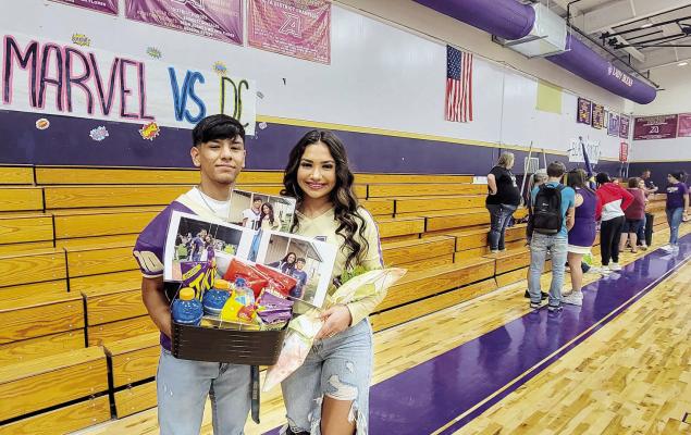 It was both a surprise and a great way to celebrate and wrap up the Alpine High School pep rally held on Sept. 16 as students Iden Lujan and Novah Carrasco paused for a photo in the gym. Lujan, a Fightin’ Buck varsity football player, asked Carrasco, a Lady Bucks varsity volleyball player, to the Homecoming Dance, where she received a gift box and other goodies to celebrate the occasion. Avalanche photo by Roxanne Hill