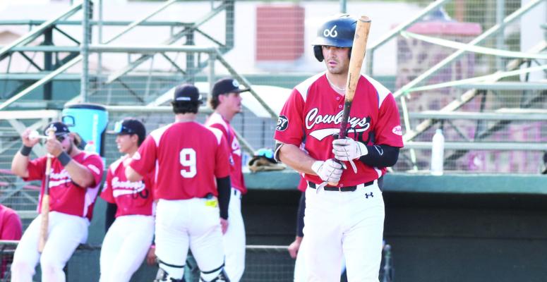Center Fielder A.J. Folds strolls to the plate during the Cowboys’ matchup against Tucson. Photo by Julie Myers
