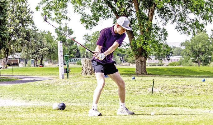 Eighth-grade golfer John Ritchie rears back to drive his golf ball down the fairway towards the green on Tuesday afternoon during the boys’ middle school golf tournament. Photo by Kara Gerbert