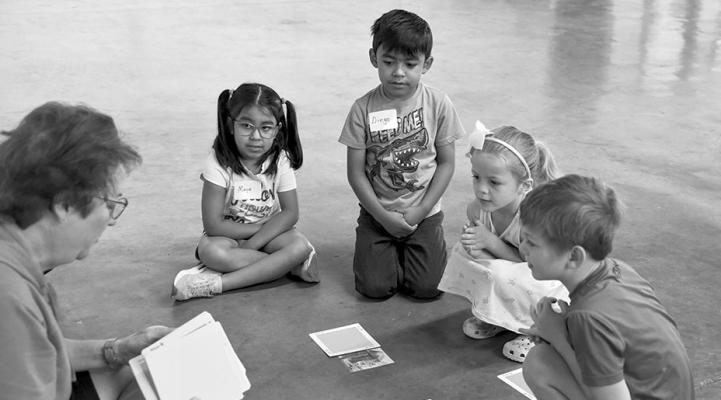Led by Terri Harkey, Maya Aguilar, Diego Aguilar, Maggie Dabbs, and Ellis Adams listen attentively this past Monday, during a session of Camp Curiosity that is put on by the Marathon Public Library.