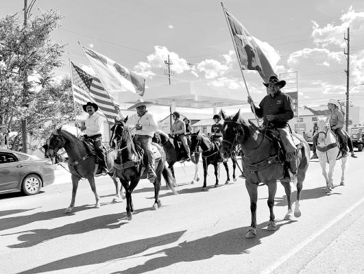 A mounted color guard leads the way for Alpine’s Cinco de Mayo parade through downtown on Holland Avenue on May 4, 2019. This popular celebration returns to Alpine on May 7 after a two-year hiatus.
