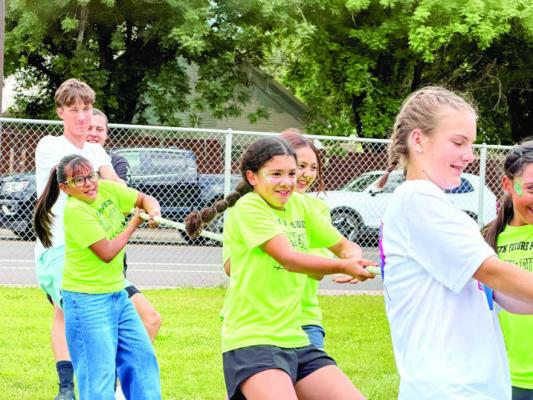 Miguel Batres, Kelton Tarrant, and Molly Garrett grabbed the rope to help out these Alpine Elementary students win the tug of war contest during AES’s field day last week. Courtesy photo