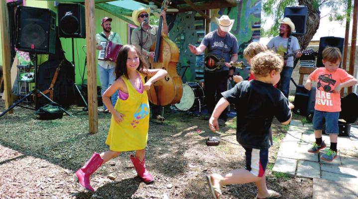 Children do some boot scootin’ at a Mr. Will show at a past Viva Big Bend event. Courtesy photo