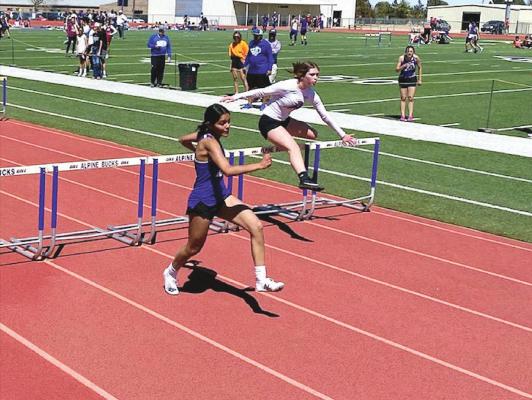 The Alpine High School girls varsity won the Fightin’ Buck Relays in Alpine on March 19. In the photo Jaycee Portillo and Amanda Ahrens run the 100-meter hurdles