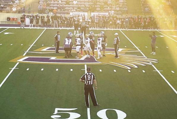 The Bucks joined members of the Cougars team for the coin toss to begin last Thursday’s game in Odessa. Photo courtesy of Cynthia Payne