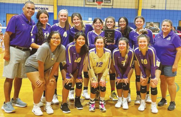 The Alpine High School Lady Buck varsity volleyball team show off its award after besting Sonora last weekend in San Angelo. Avalanche photo by J.T. Maroney