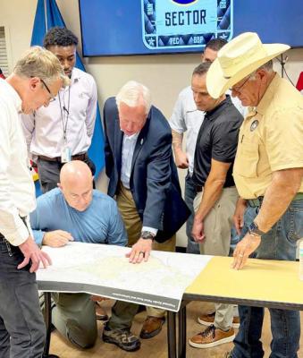 Customs and Border Protection Commissioner Rodney Scott was in Alpine on Tuesday, meeting with area officials about construction in the Big Bend concerning the border wall. Here, Scott (left) looks at a map with Brewster County Judge Greg Henington (center) and Brewster County Sheriff Ronny Dodson (right). Courtesy photo