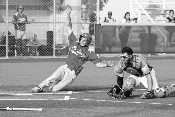 Alpine Cowboy player slides into home plate during their season opener against the Pecos Bills. Photo by Julie Myers