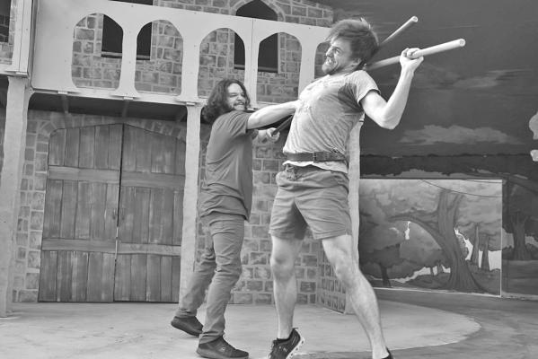 Mason Forringer (right), who stars as Robin Hood, and Cameron Owens, in the role of Little John, practice a fight scene at the Kokernot Outdoor Theatre. Courtesy photo