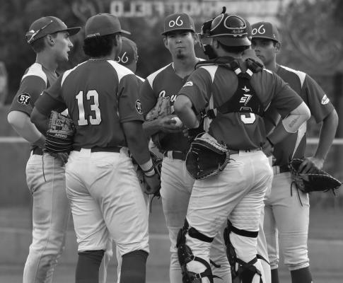 The Alpine Cowboys defense confers on the mound in their recent series matchup against the Pecos Bills. Photo by Julie Meyer