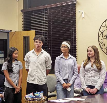 Members of the Alpine High School Student Council gave a presentation on Wednesday night to the AISD Board about the multiple projects and events they collaborate on for AHS students, faculty, staff, and community. From left are Rose DeGuia, J.P. Prieto, Megan Struthers, and Abigail Scott. Photo by Kara Gerbert