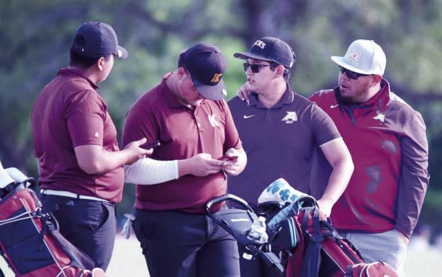 Coach Marco Gomez gives David Baca some words of encouragement at last week’s regional golf tournament in Abilene. Baca just missed pushing a second tie-breaker hole by a putt for par. Photo by Noe Lujan