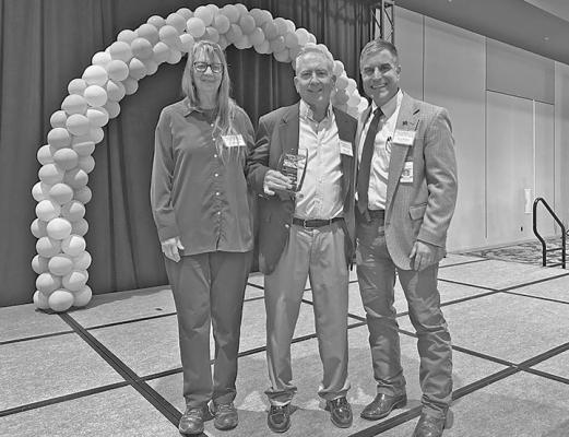 Dr. James Luecke is pictured with Jan Blumentritt and Dr. Adrian Billings after receiving his award for Healthcare Pioneer Clinician. Courtesy photo