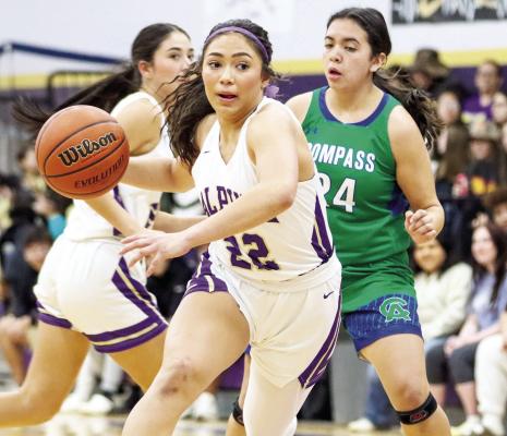 Novah Carrasco drives the lane, Friday night against Compass Academy. The Lady Bucks would go on to win the game 65-19. By Shawn Yorks
