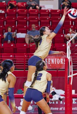 Neveah Carrasco connects with the ball during the Lady Bucks’ recent match-up against Denver City. Courtesy photo