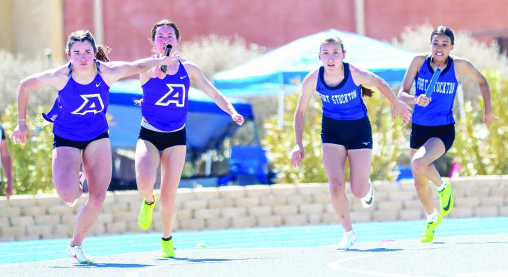 Alpine’s Valeria Crespo, left, takes the handoff from Mia Morris during the 4x100-meter relay during the 80th Comanche Relays Saturday in Fort Stockton. At right, Fort Stockton’s Havyn Gaytan prepares to take the baton from Larie Belle Urbano. Photo by Shawn Yorks
