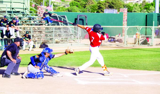 The Cowboys’ Luke Hyzdu takes a swing during Alpine’s homestand against the Saguaros. Photo by Kara Gerbert