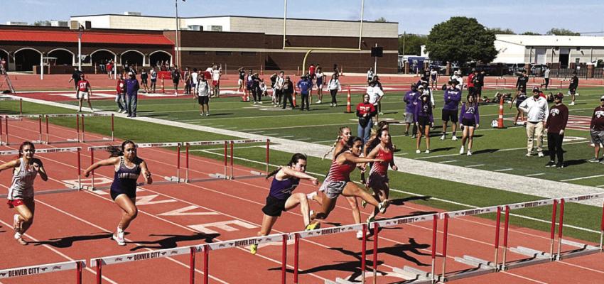 Mia Morris flies through the air, ready to clear her hurdle in one of her first-place finishes during the 100m and 300m hurdles at the area track meet in Denver City last weekend. Photo by JT Maroney
