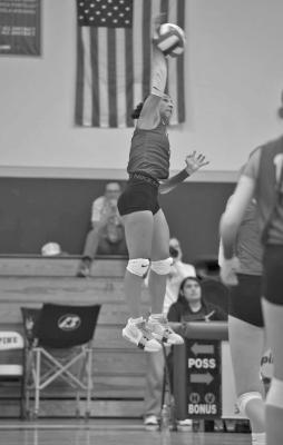 Senior Hope Dominguez exhibits some serious vertical hang-time as she attempts to return the ball against the Van Horn Eagles in last week’s home opener. Photo by Annika Canaba