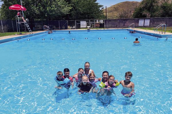 These youngsters are taking full advantage of the newly remodeled Alpine city pool this summer. From left are Maverick and Camden McEntire, Brooklyn Hendryx, Megan, Brooklyn, and Jameson Beard, and Lindley, Keller, and Layne Lutz. Photo by Kara Gerbert