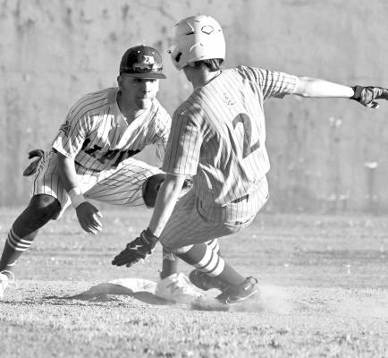 Iden Lujan tags out a Kermit player as he attempts to slide into base. Photo by Felipe Fierro