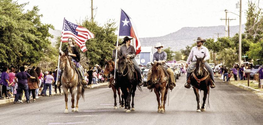 Homecoming parade led by mounted color guard