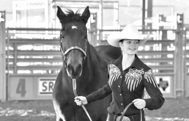 Kendall McComb trots her horse during the horse competition held this past Friday. Photo by Felipe Fierro