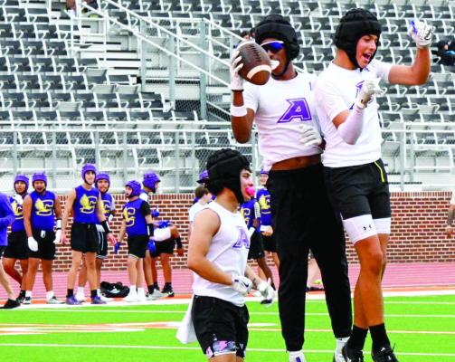 The Bucks enjoy a victory jump in their defeat over Crane in Game 1 of last weekend’s 7-on7 state qualifier. Photo by Felipe Fierro